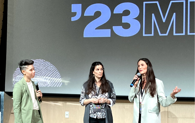 Regina and Alejandra standing on the stage of Design Matters 2023
